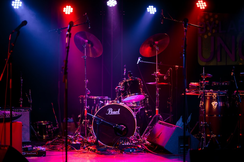 a desktop computer sitting on stage with stage lights and an audience