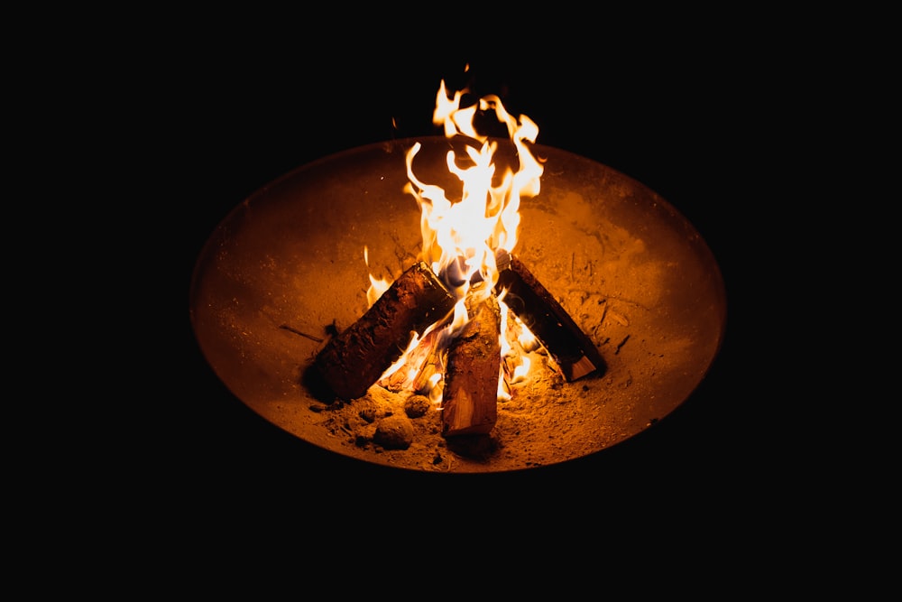 a fire pit with flames burning in it