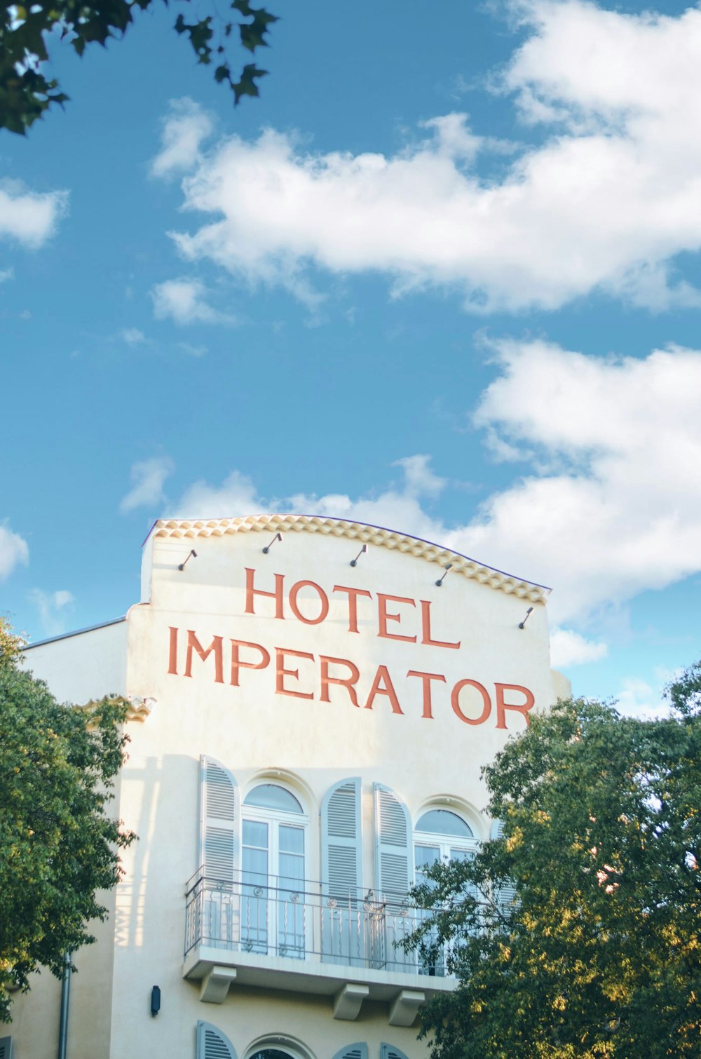 a building with a sign that says hotel imperator