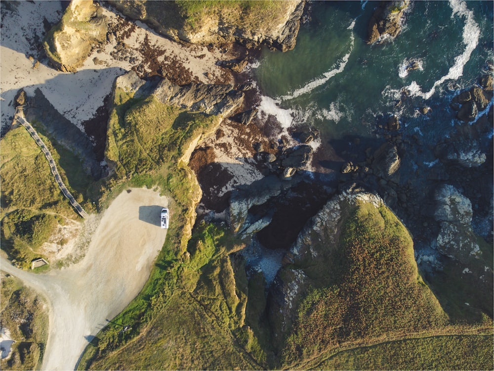 a bird's eye view of a beach and a body of water