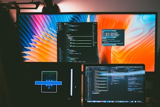 a computer monitor sitting on top of a desk