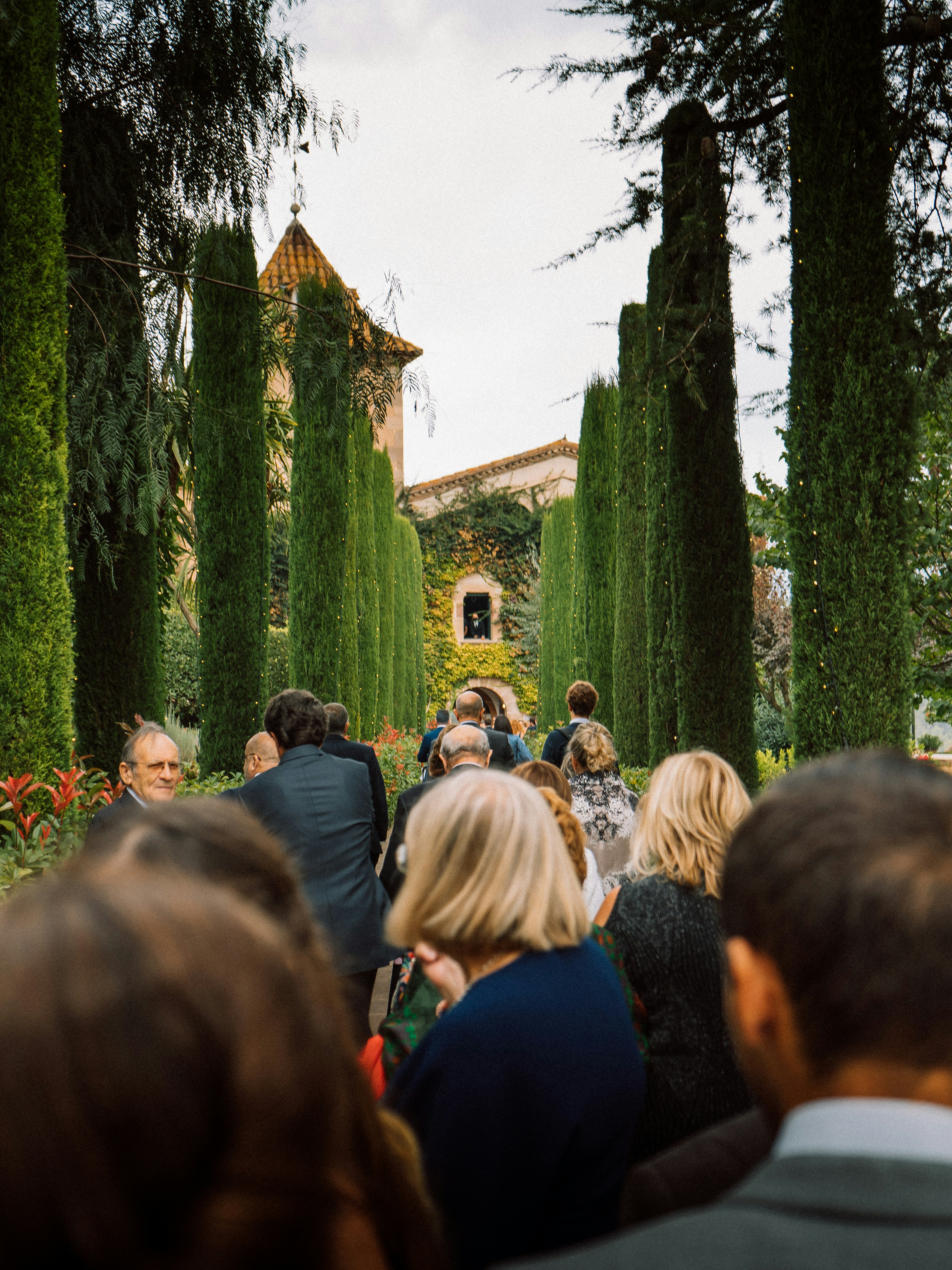 a group of people that are standing in the grass