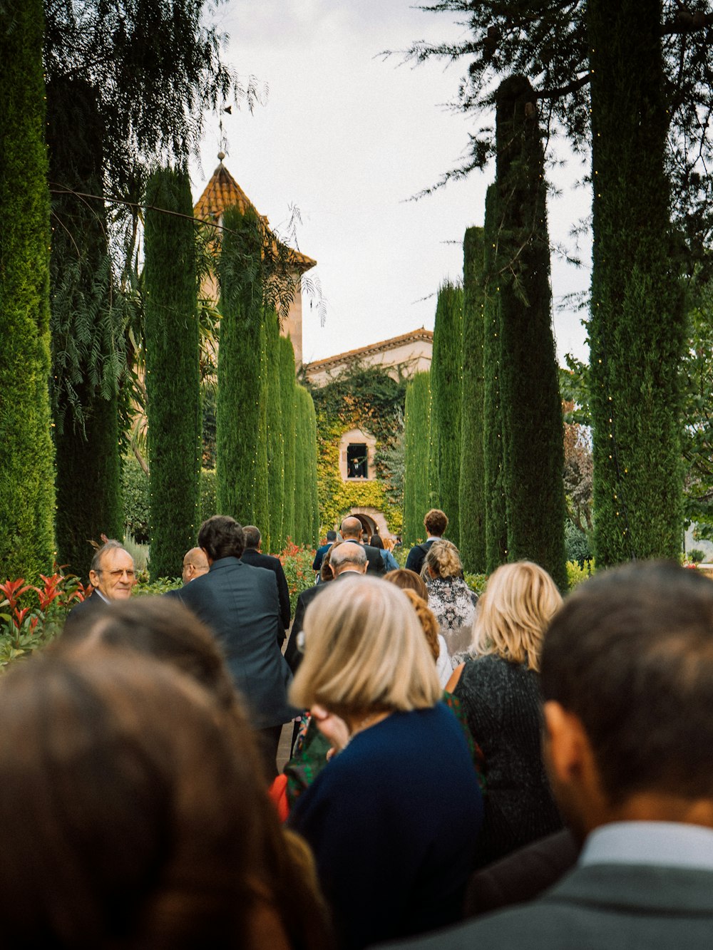 a group of people that are standing in the grass