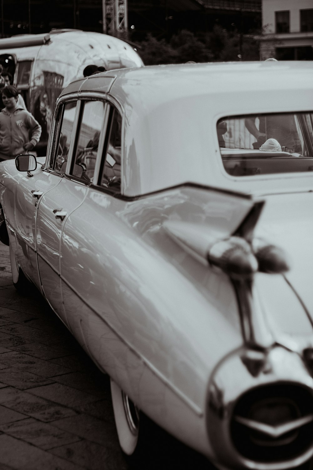 a black and white photo of an old car