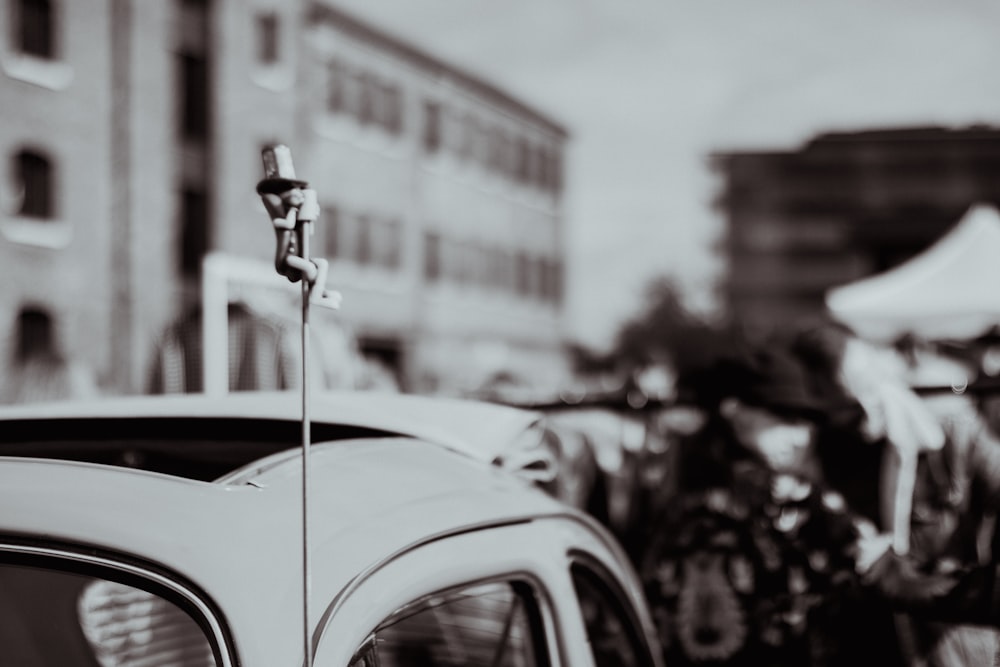 a parking meter sitting on the side of a car