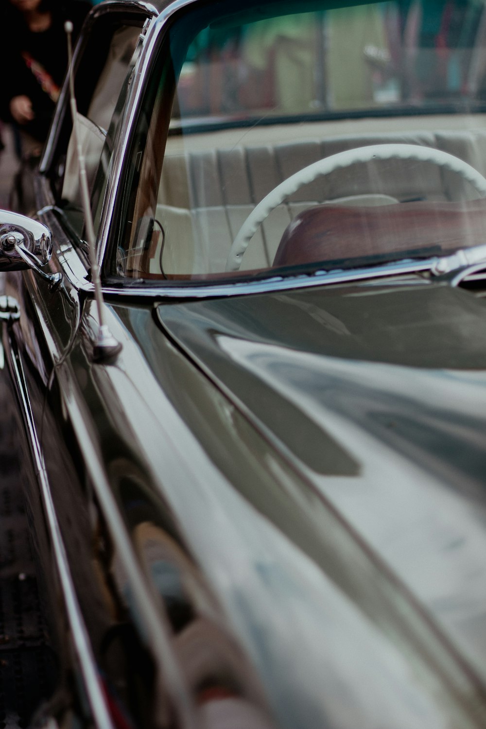 a close up of a black car with a steering wheel