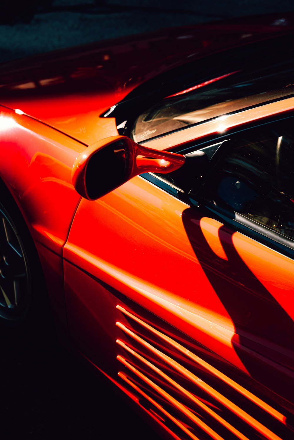 a red sports car parked in a parking lot