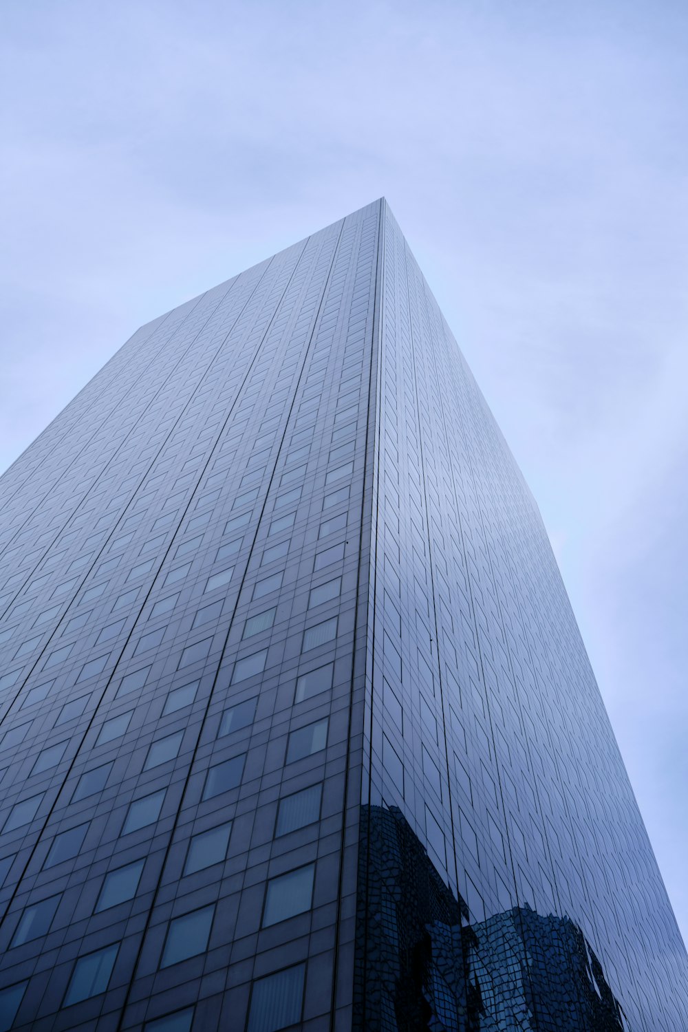 a very tall building with a sky background