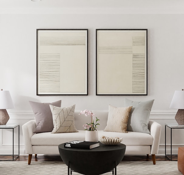 a living room filled with furniture and a potted plant