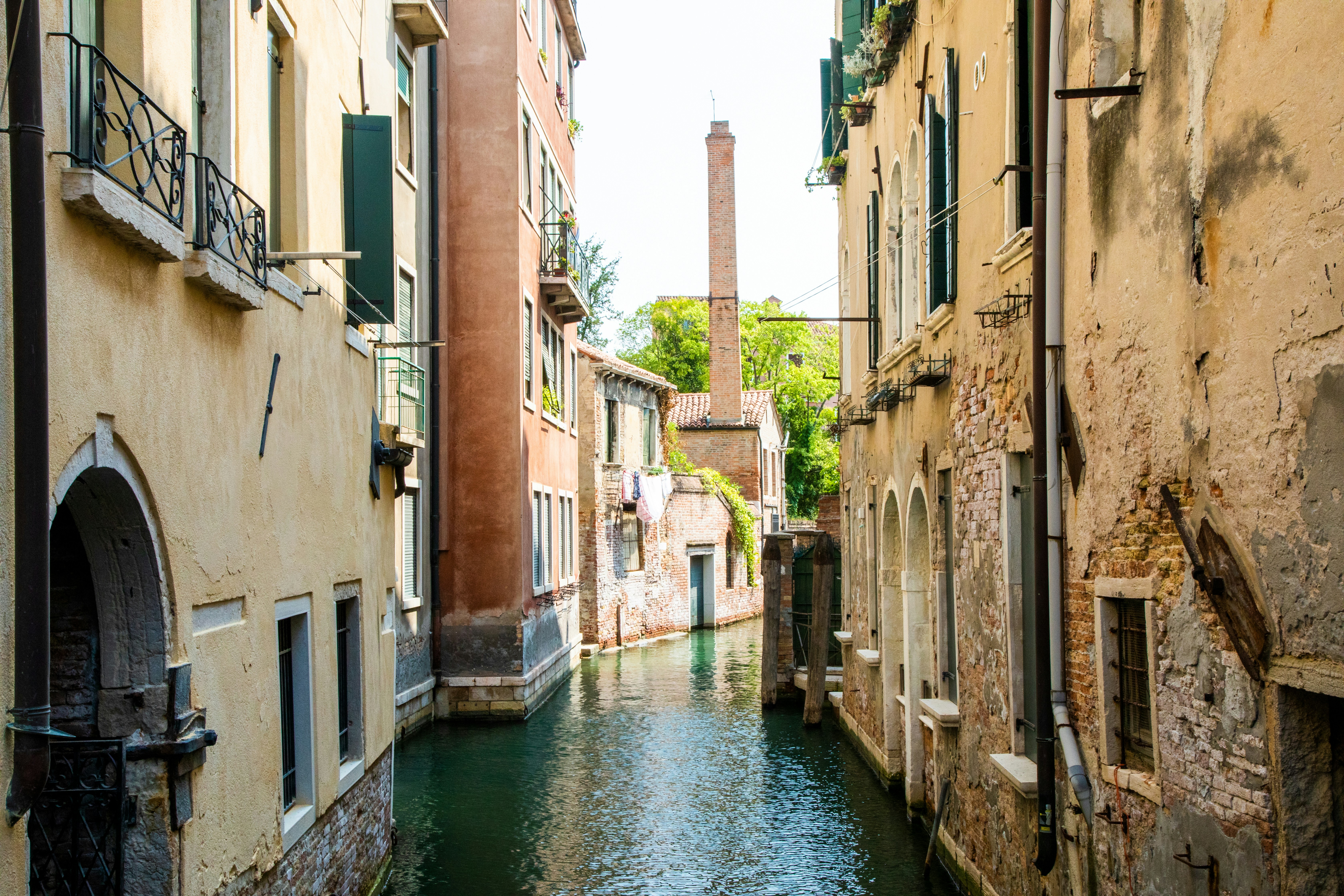 A narrow canal running between two buildings in a city