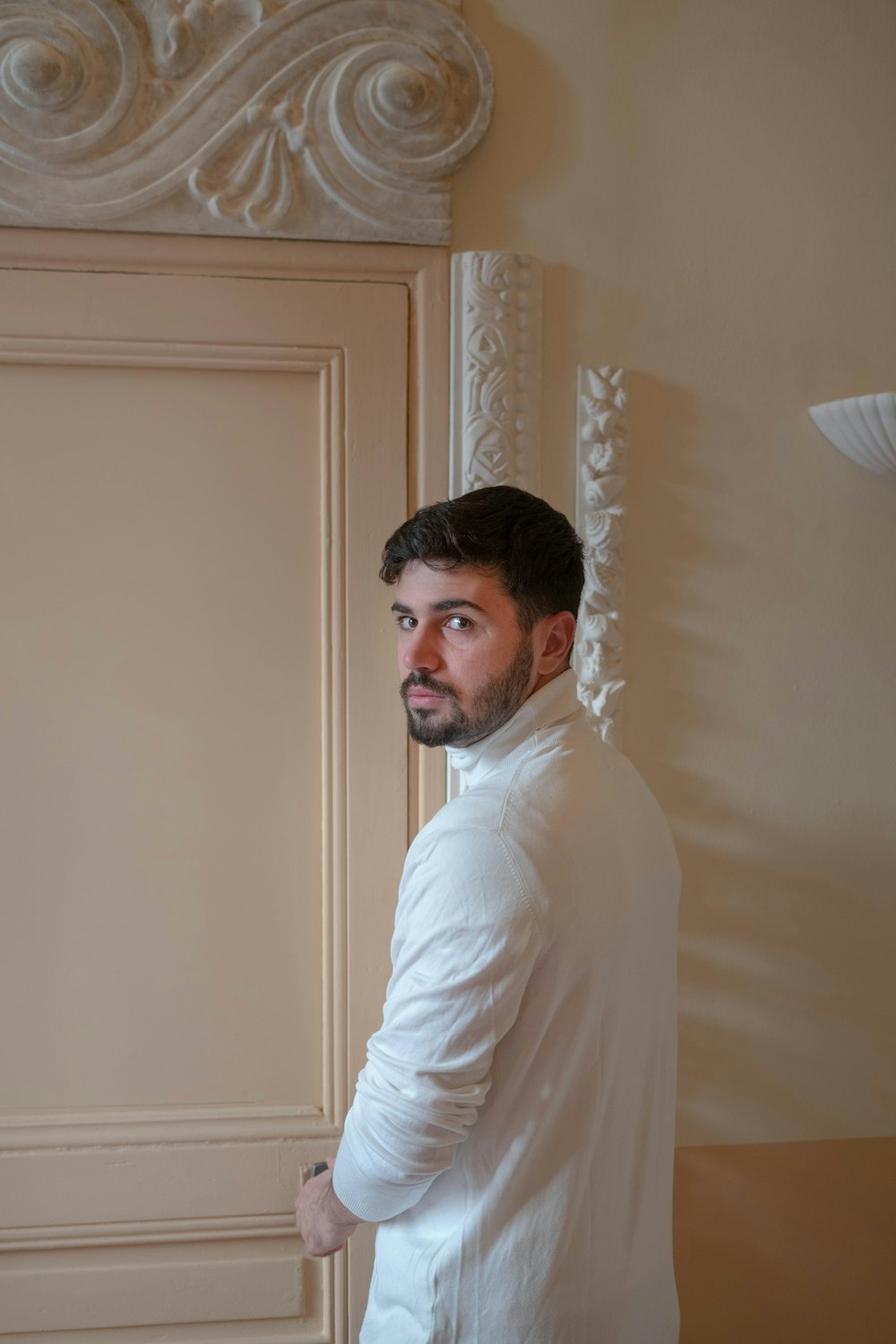 a man is standing in front of a door