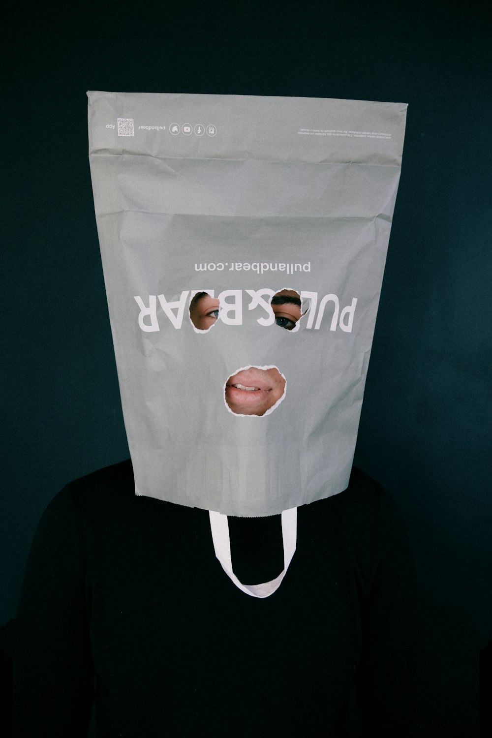 a person with a paper bag on their head