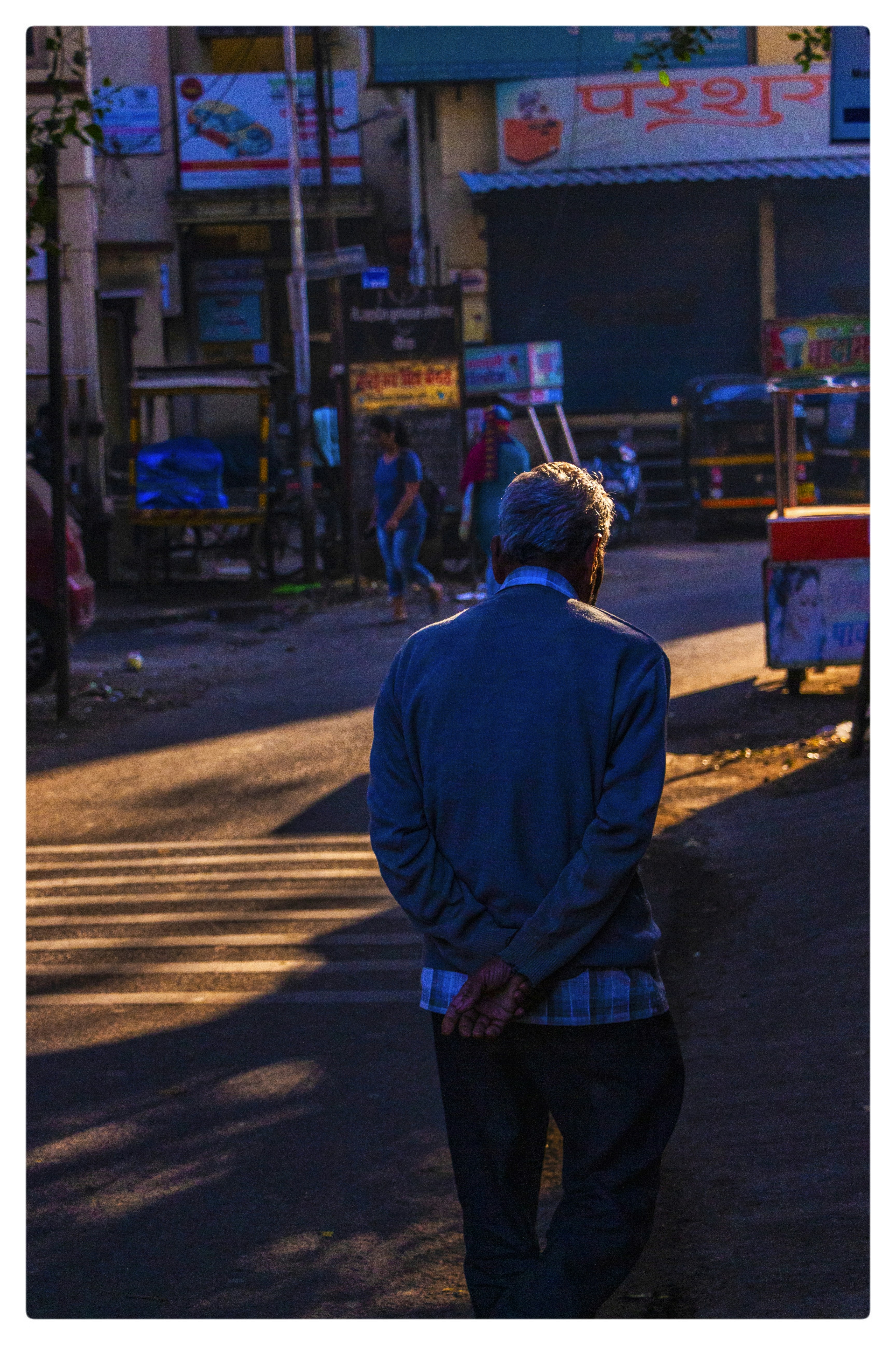 a man standing on the side of a road