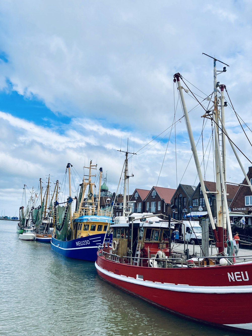 a group of boats that are sitting in the water