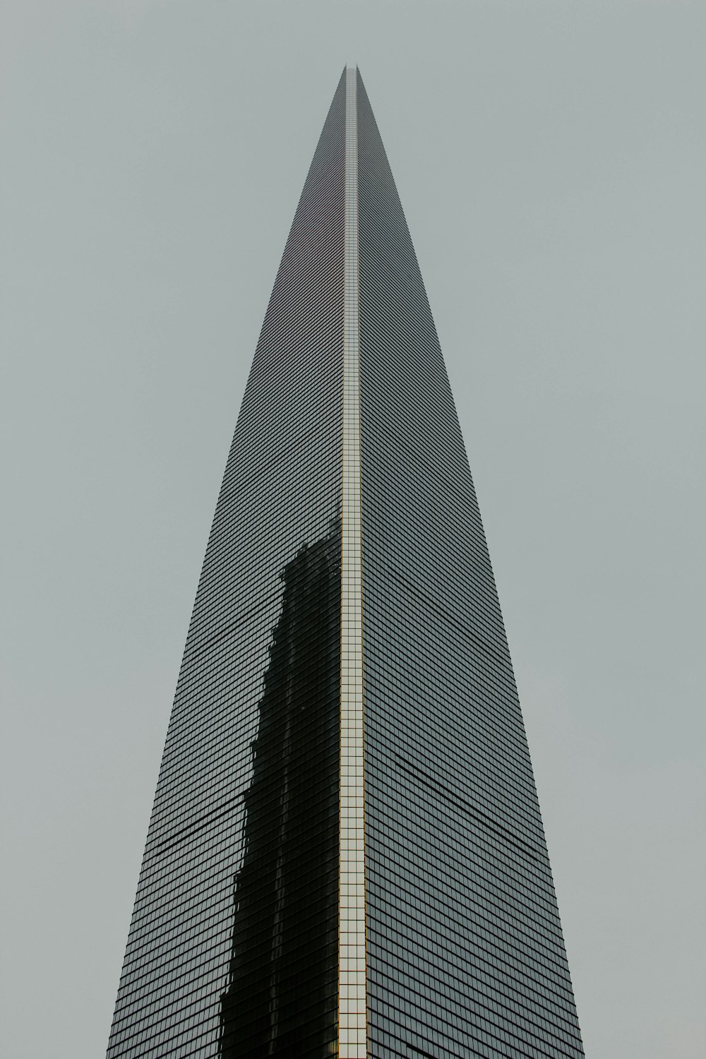 a very tall building with a clock on it's side