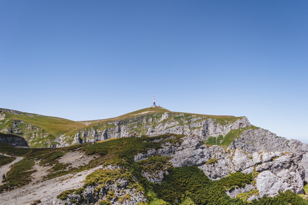 a hill with a lighthouse on top of it