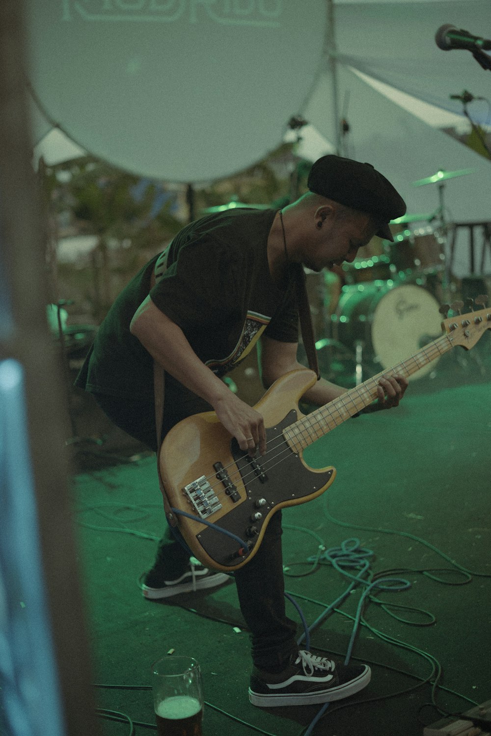 a man playing a guitar on a stage