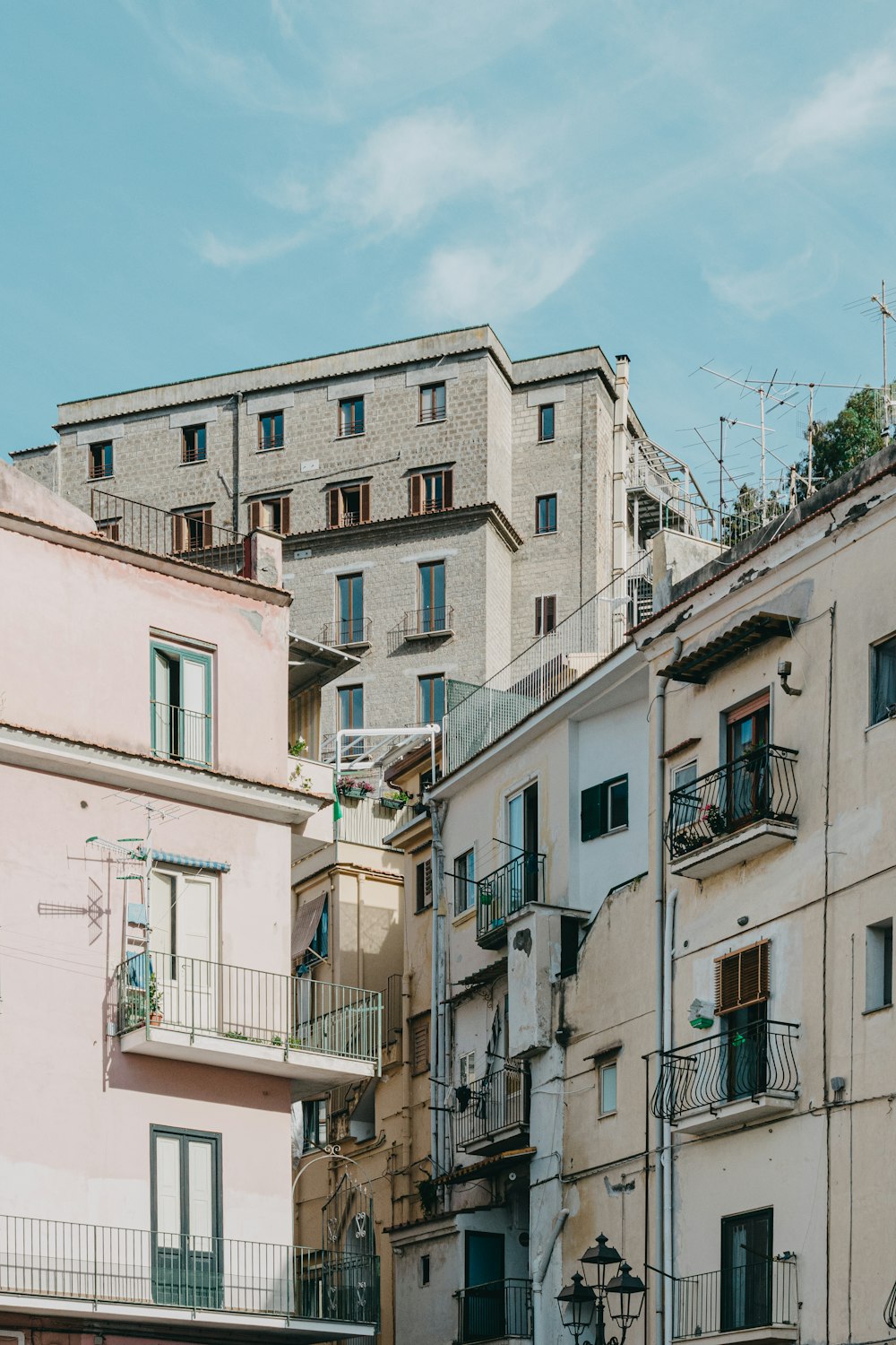 a group of buildings with balconies and balconies on top of them