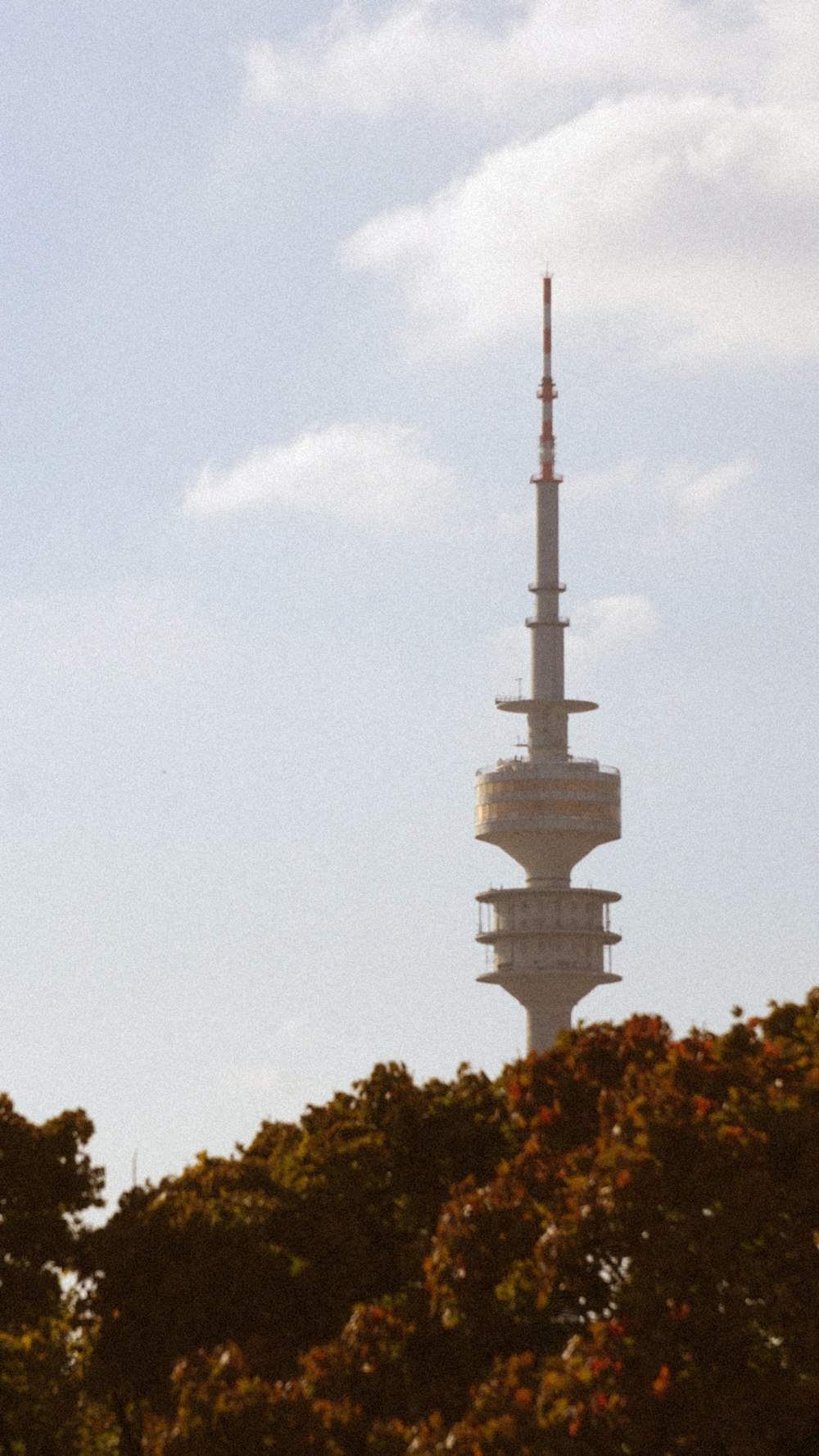 a very tall tower with a clock on it's side