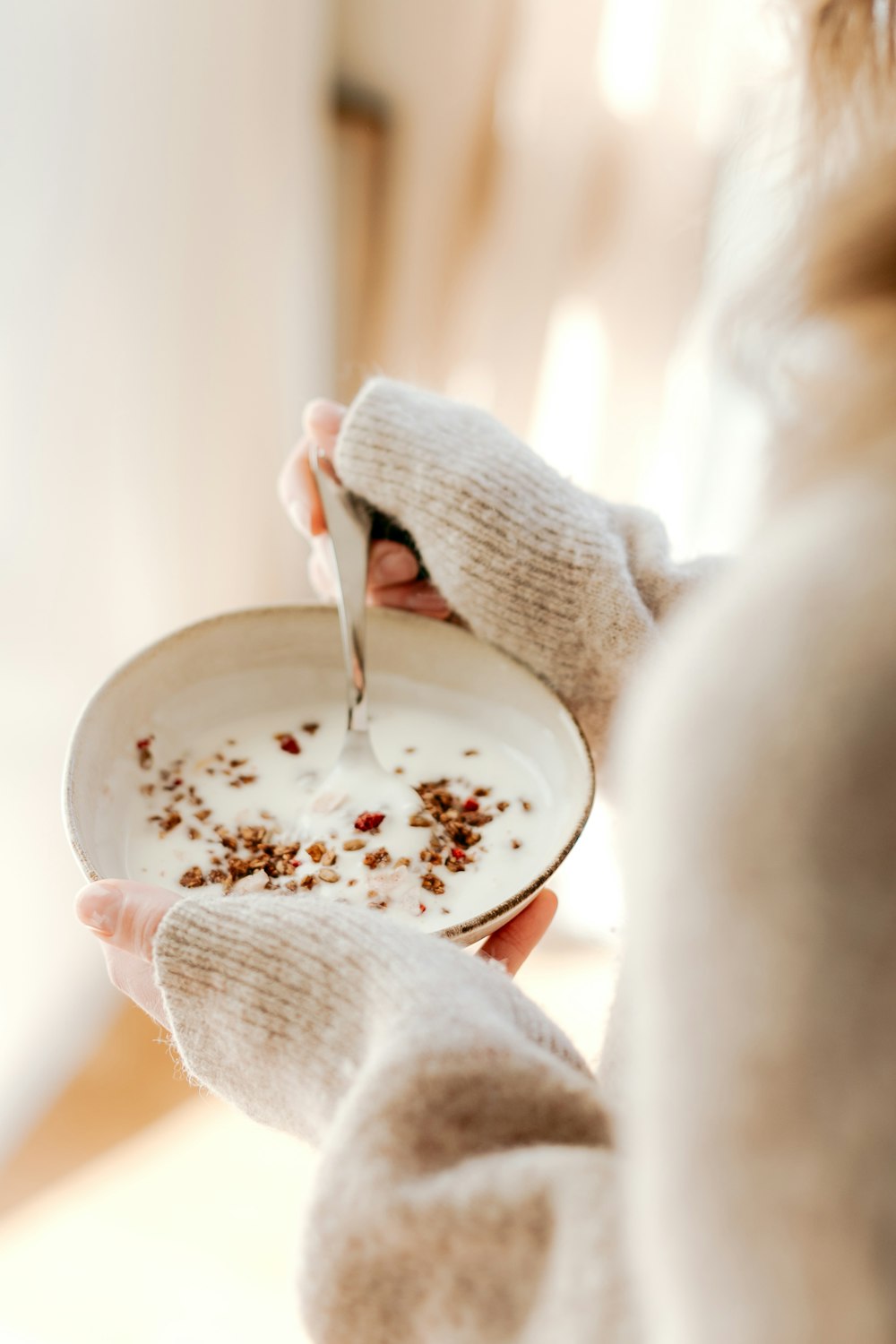 a person holding a plate with food on it