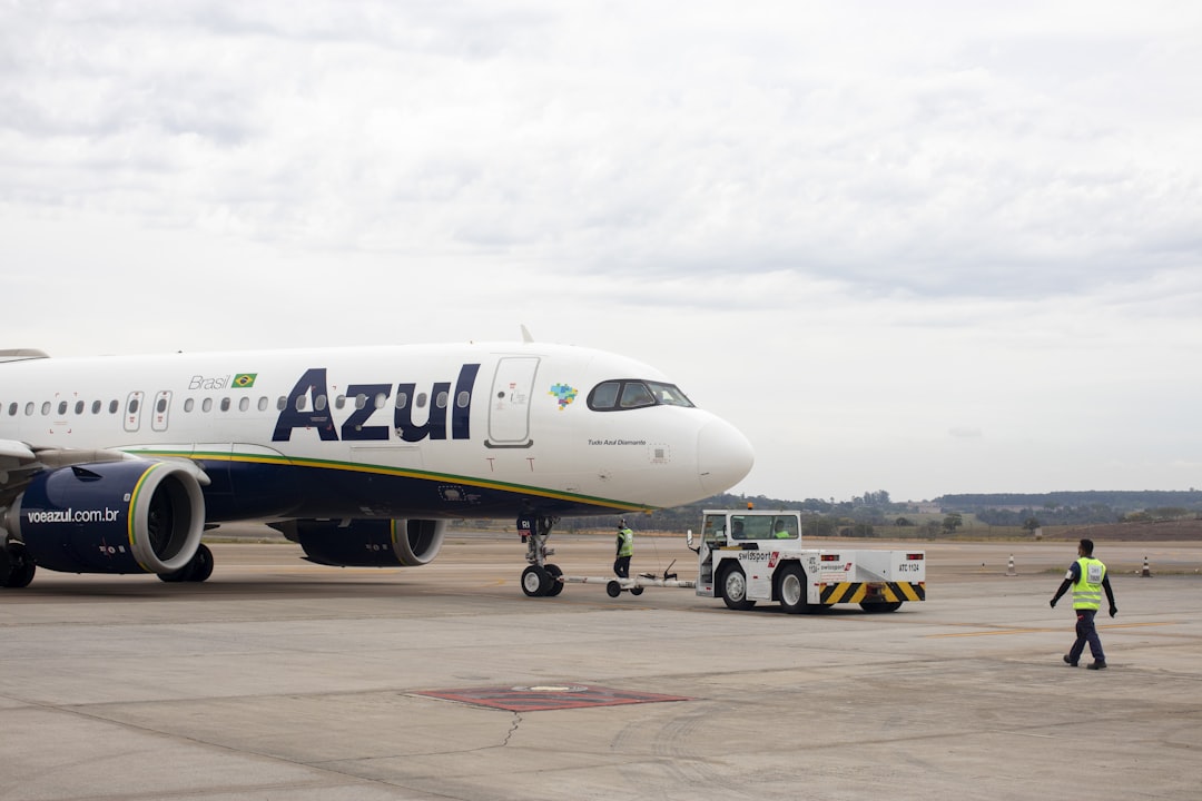a large jetliner sitting on top of an airport tarmac,
