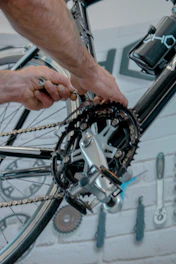a close up of a person working on a bike