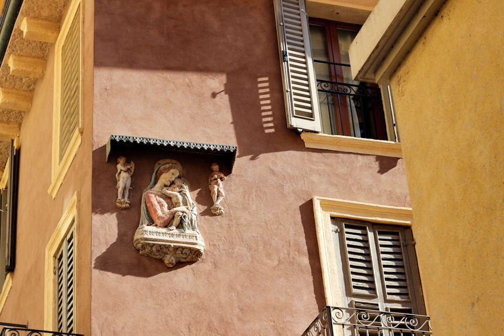 a building with a statue of a woman on the outside of it