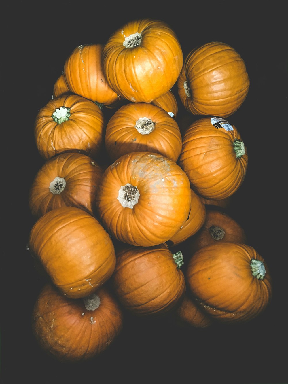 a pile of pumpkins sitting on top of each other