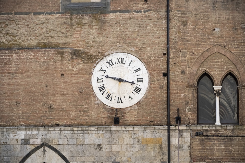 a large clock on the side of a building