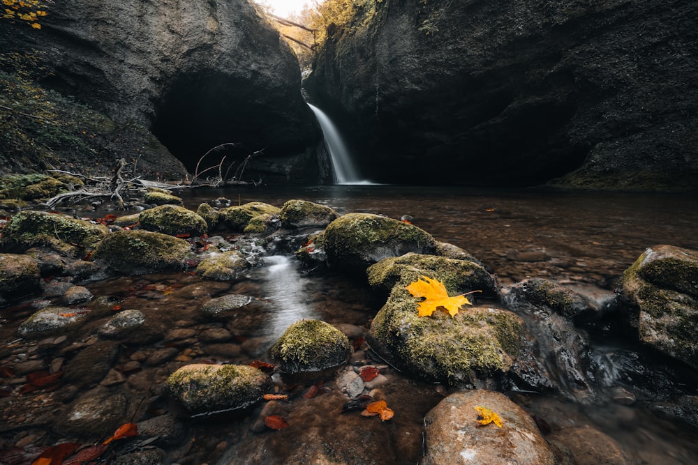 a large waterfall over a rocky cliff