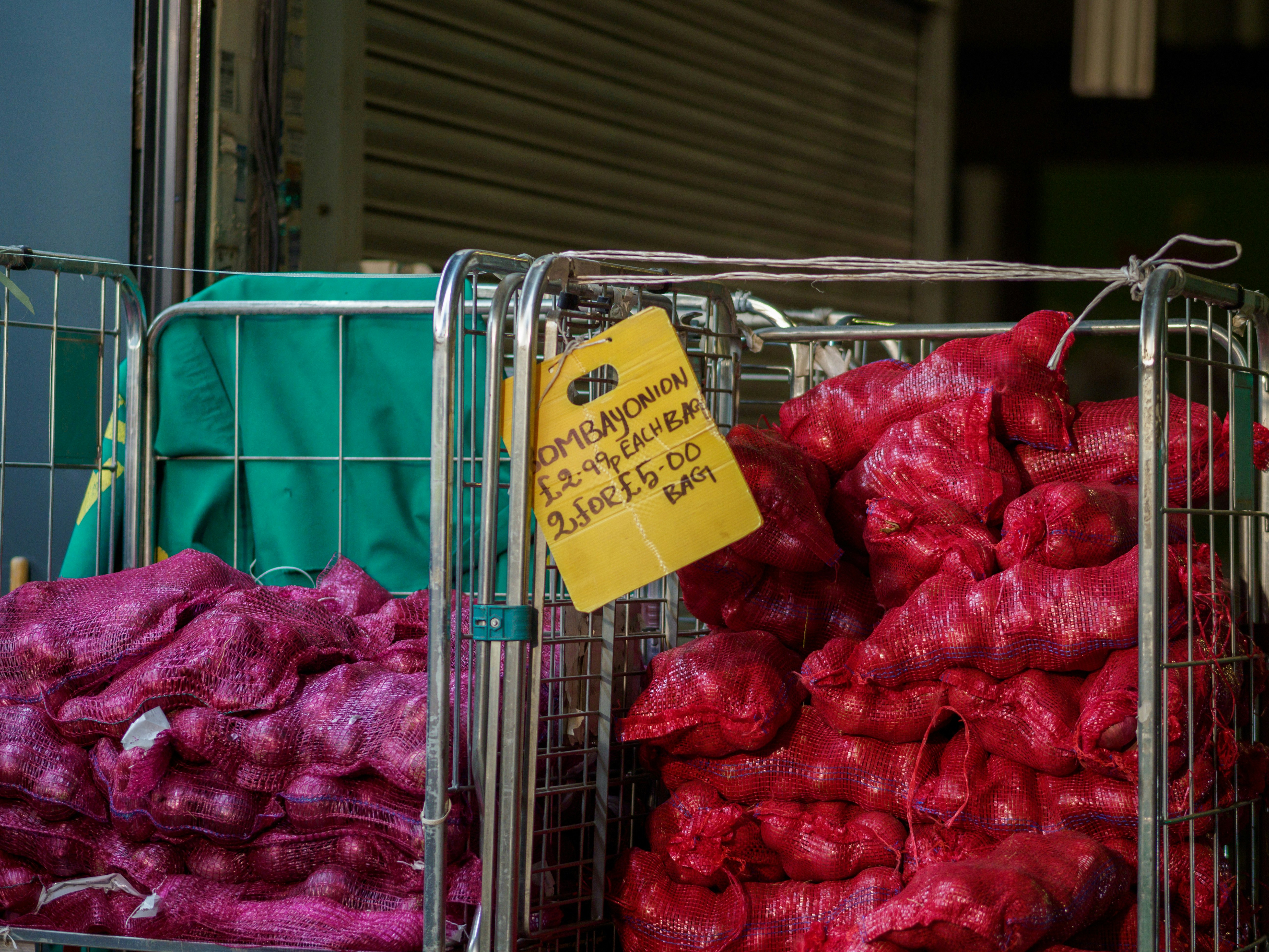 Sacks of red onions in a wholesale trolley