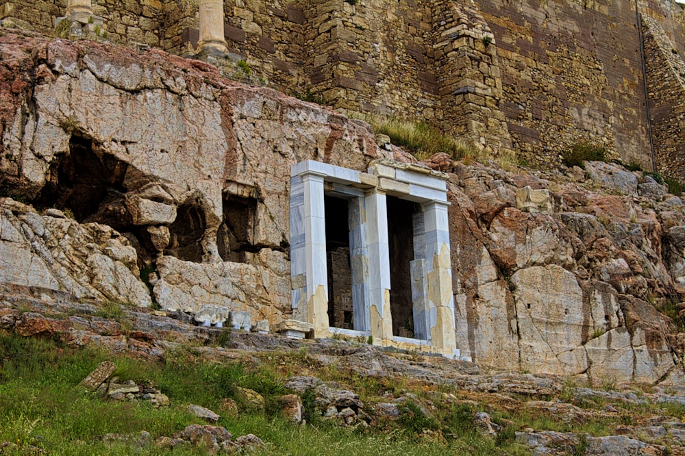 a stone wall with a window in it