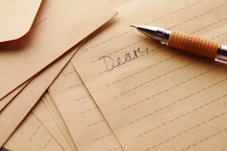 a pen sitting on top of a piece of paper
