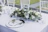 A beautifully decorated wedding table with elegant chair covers and floral centerpieces.