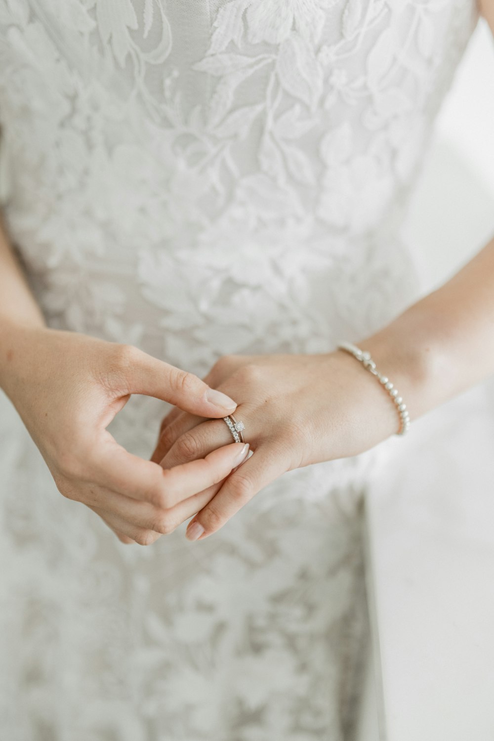 a close up of a person wearing a wedding ring