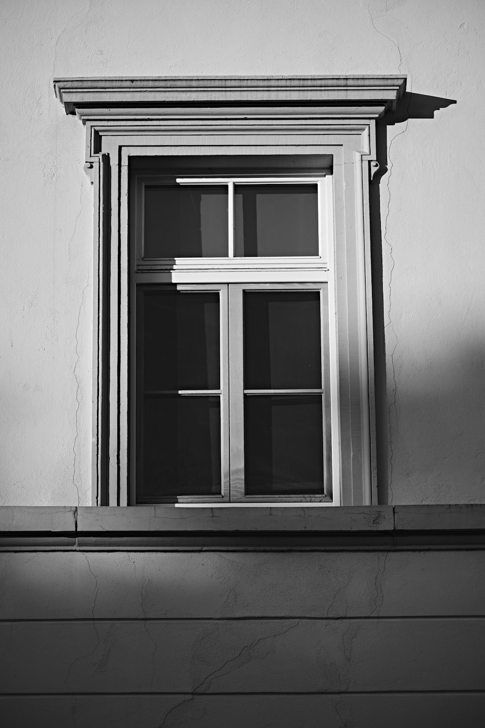 a black and white photo of a window