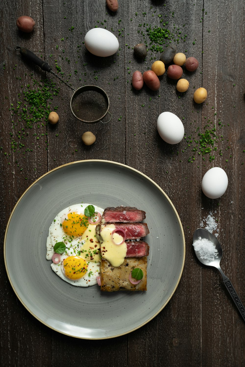 a plate of food with eggs and meat on it