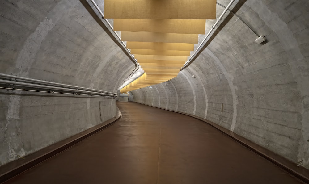 a very long tunnel with a light at the end