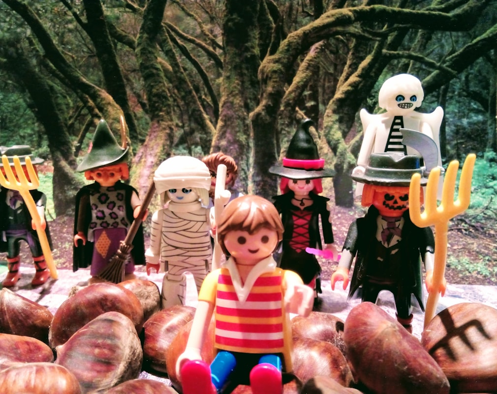 a group of toy figurines sitting on top of a pile of potatoes