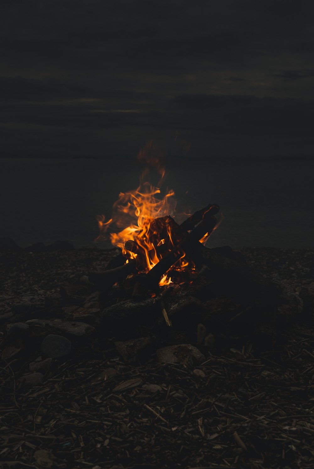 a fire burning in the middle of a field