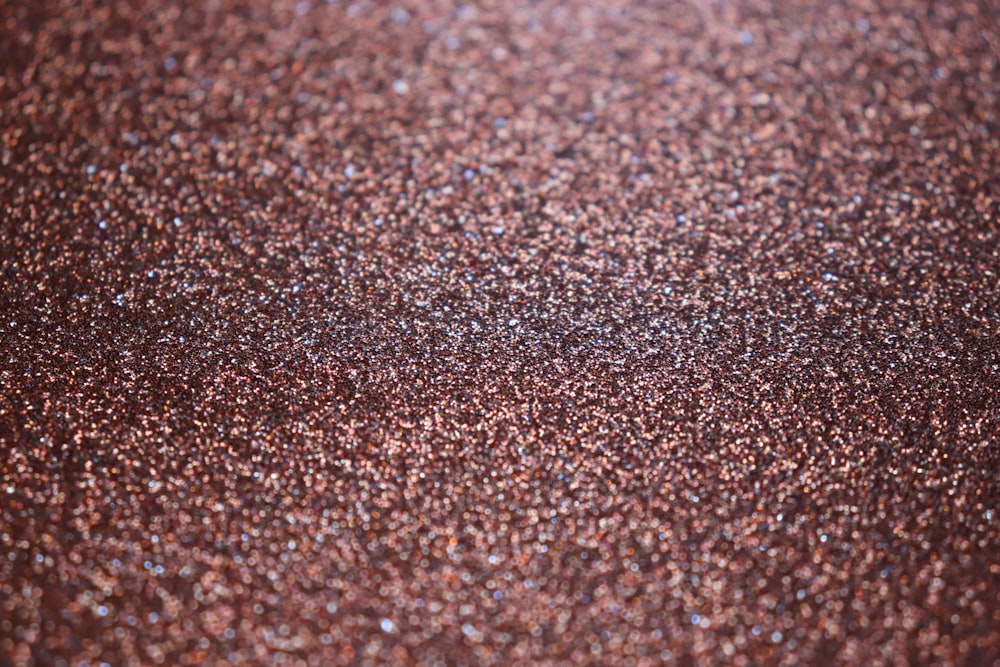 a close up of a brown glitter background