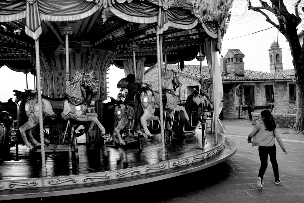 a black and white photo of a merry go round