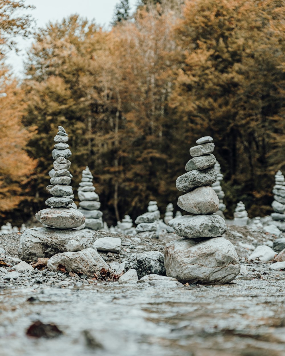 a pile of rocks sitting on top of a river