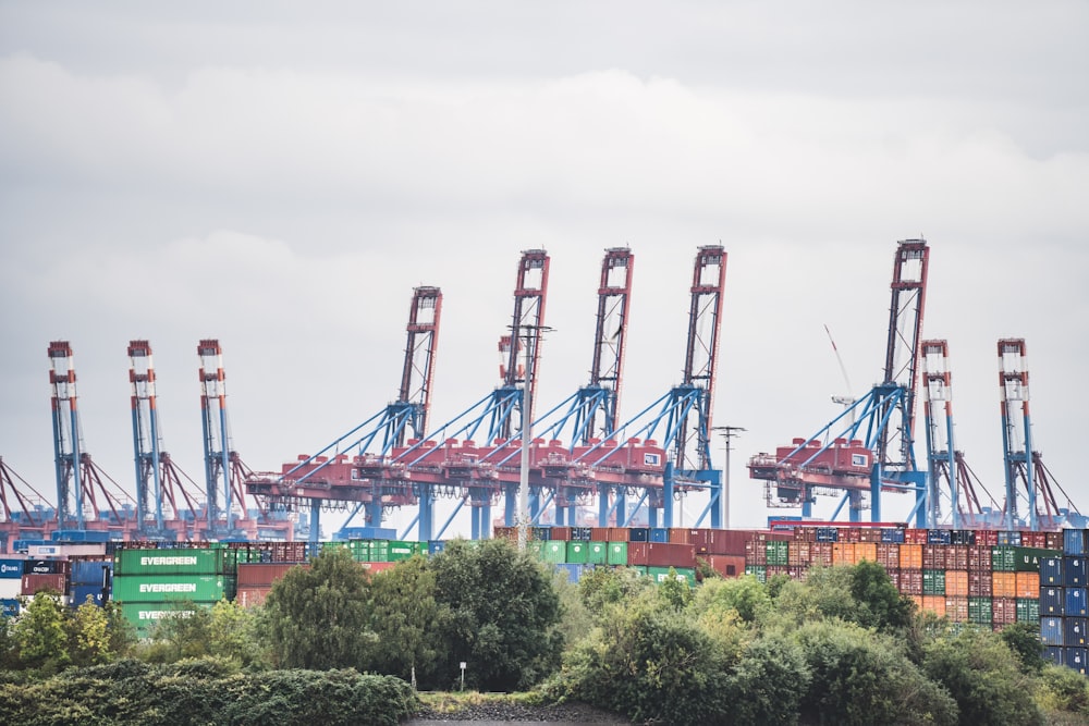 a bunch of cargo containers are stacked on top of each other