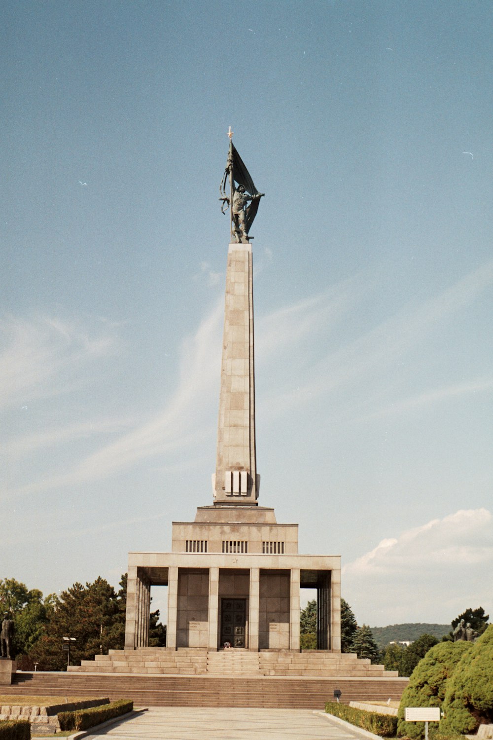 a monument with a flag on top of it