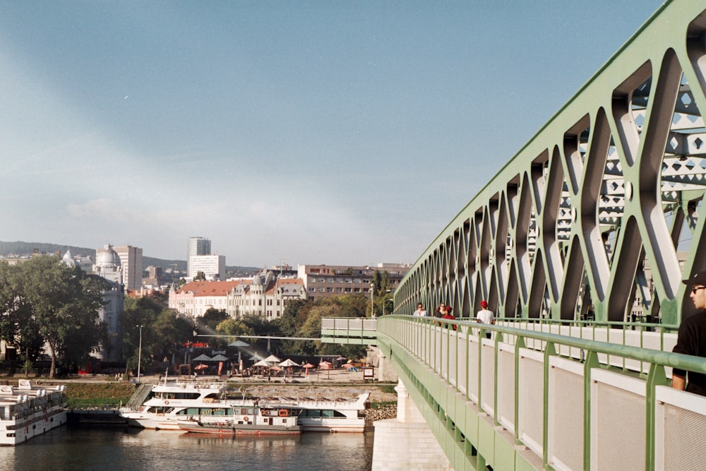 a bridge over a body of water with boats on it