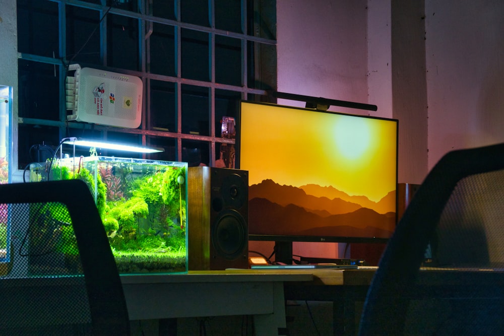 a computer monitor sitting on top of a desk