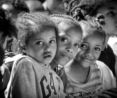 a group of young girls standing next to each other