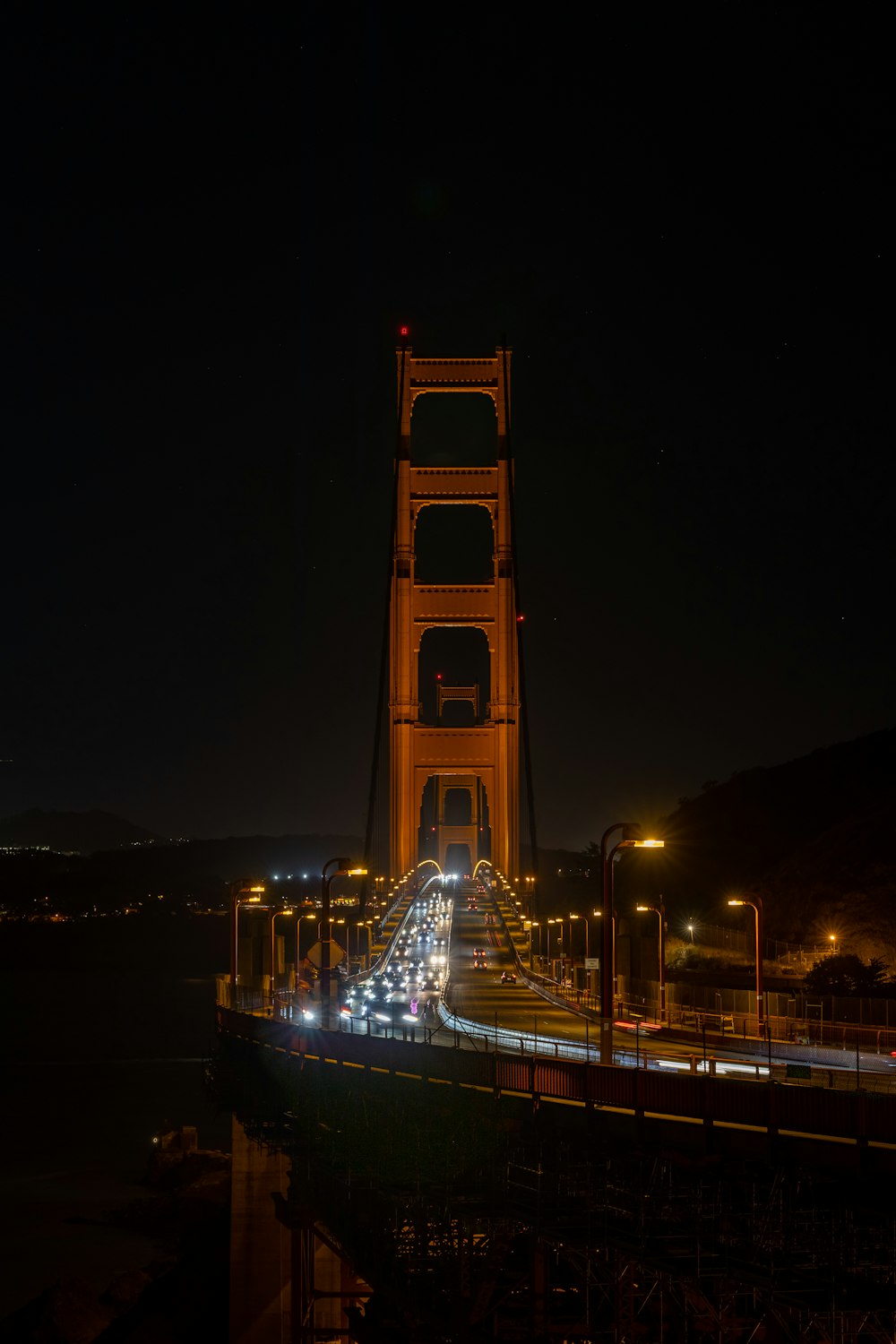 a very tall bridge with a bunch of lights on it