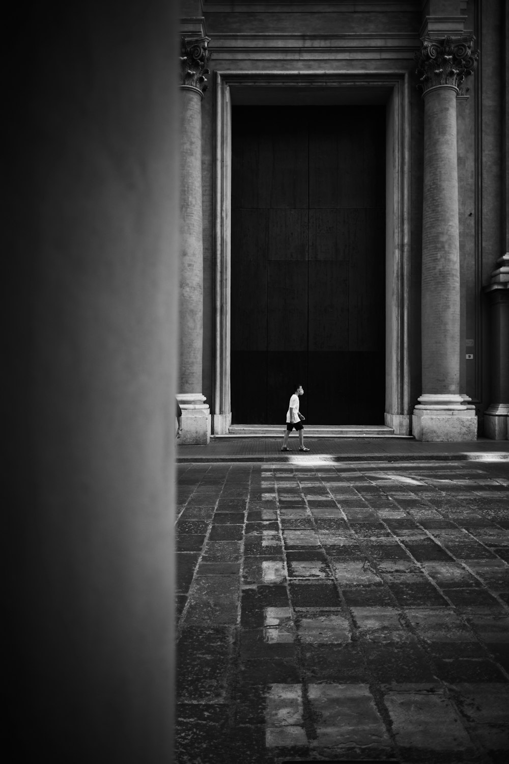 a person standing in front of a building